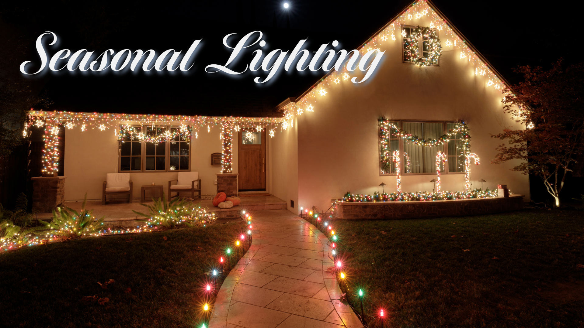 Creative displaying decorative lighting on the front of a well decorated home. Get your free consulation from Graceful Grounds.