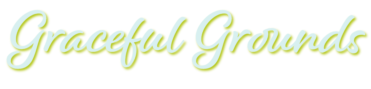 Graceful Grounds, white text only logo in cursive writing.